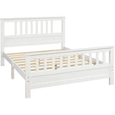 A white bed frame featuring wooden slats, designed for a modern and minimalist bedroom aesthetic.